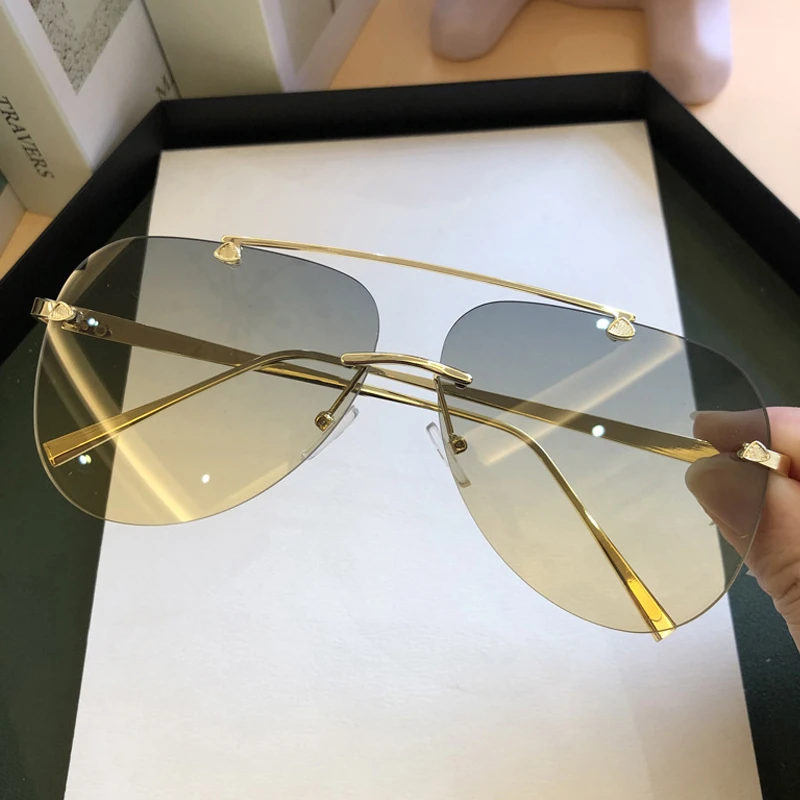 ヴィンテージリムレス合金航空パイロットサングラス男性用ブラン - Vintage Fashion Brands のレビューと価格